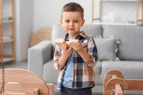 Little boy playing with tak...