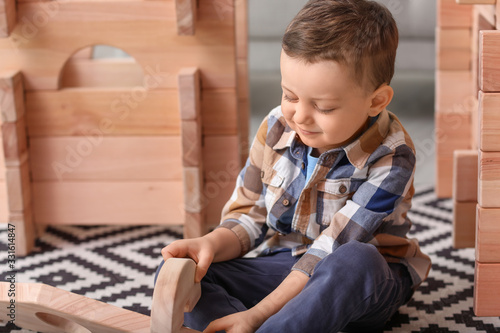 Little boy playing with tak...