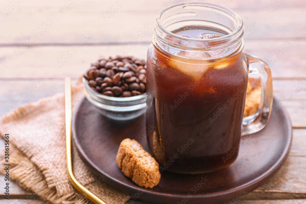 Mason jar of tasty cold coffee on table Mason jar of tasty cold coffee on table