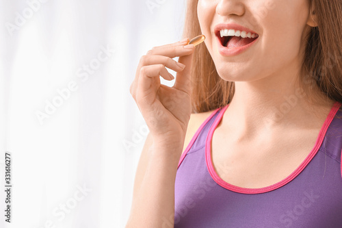 Woman taking weight loss pi...