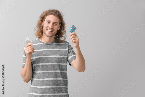 Young man with oral erectil...