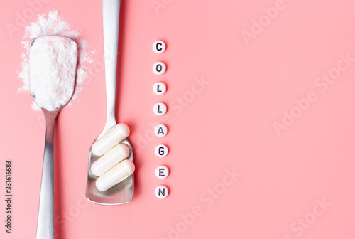 The inscription collagen and capsules with collagen powder on pink background top view. photo