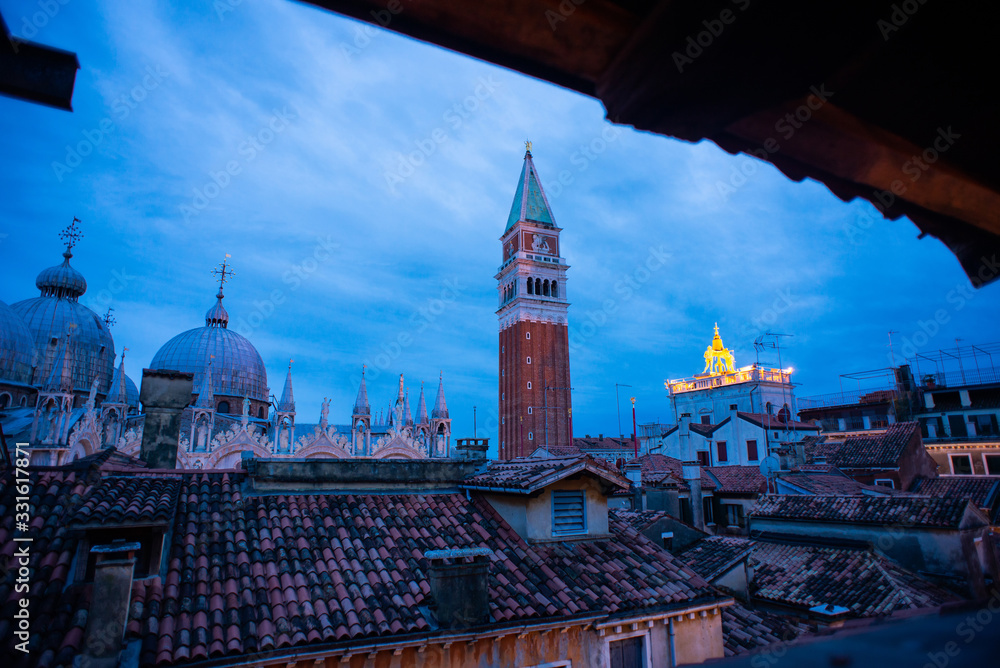 San Marco Campanile and Saint Mark's Basilica in Venice on Sunrise.