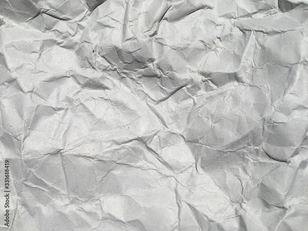 Obraz premium Top view of white crumpled paper texture background. Copy space for design and artwork