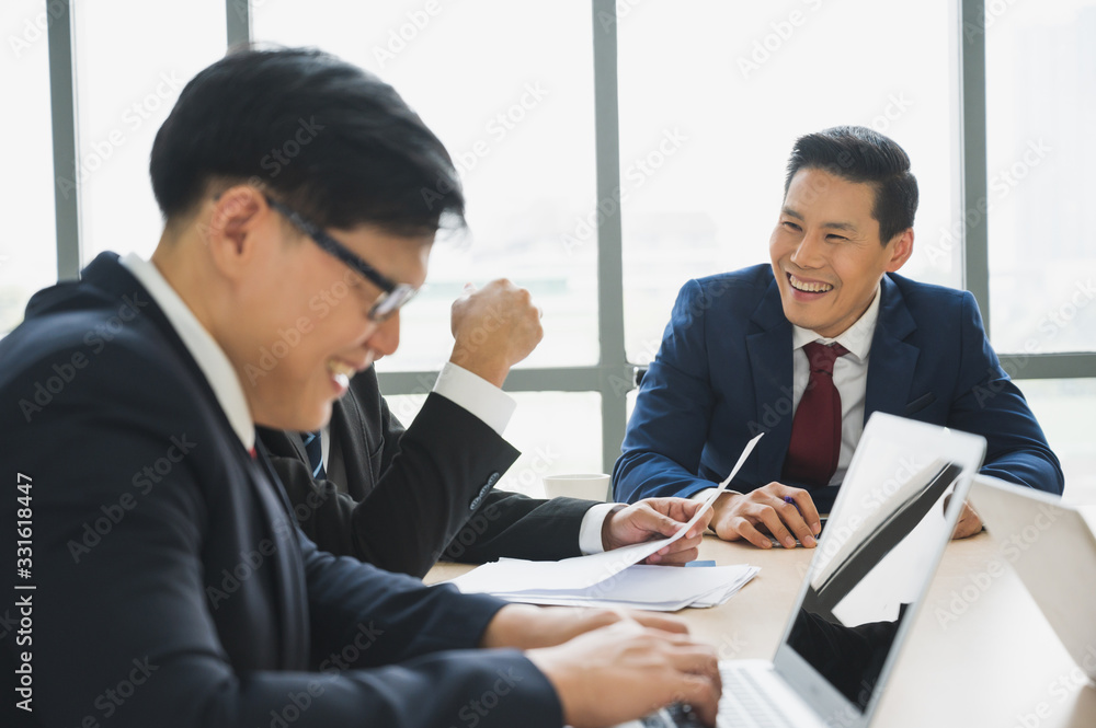 Asian business people team analyzing statistics financial. Team of businesspeople Meeting Conference Discussion Corporate Concept in office. Asian business people team analyzing statistics financial. Team of businesspeople Meeting Conference Discussion Corporate Concept in office.