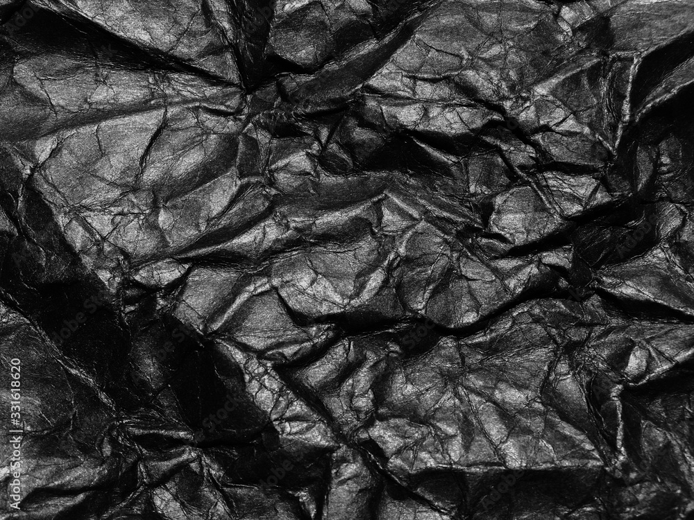 Black crumpled paper texture background. Copy space for design and artwork Black crumpled paper texture background. Copy space for design and artwork