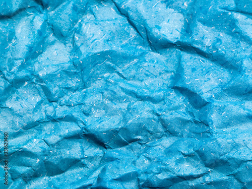 Texture of blue crumpled paper background for design