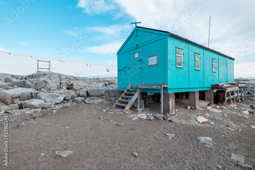 mountain hut in the snow on the shore of antarctica close to port lockroy 