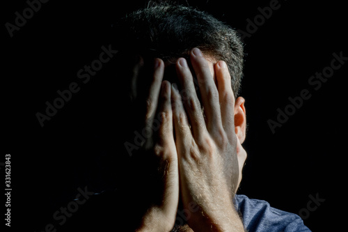 Man despair on black background with copy space