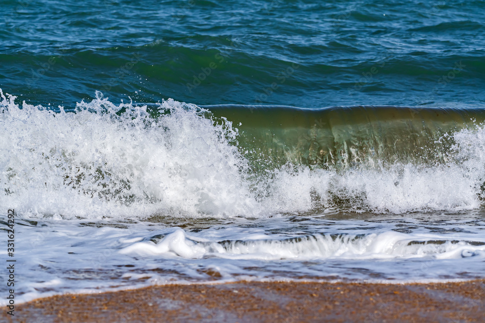 Splashing big waves on the beach Splashing big waves on the beach