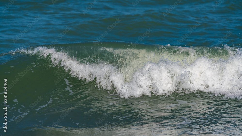 Splashing big waves on the beach