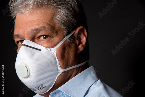 man wearing a professional ffp2 mask against virus
