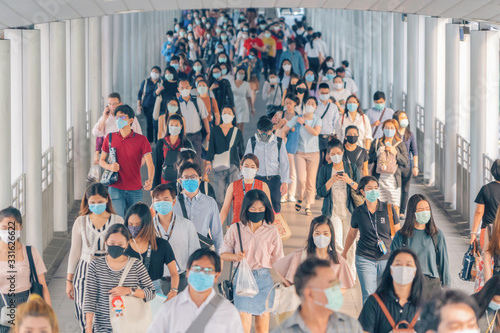 Vászonkép Bangkok City, Thailand : 03/12/2020 : Unidentified people, Crowd of Thai wearing face mask for health due to Coronavirus Disease or covid-19 and  air pollution in mass transit in public