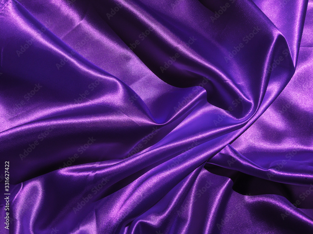 Smooth purple fabric or satin texture background with copy space for design Smooth purple fabric or satin texture background with copy space for design