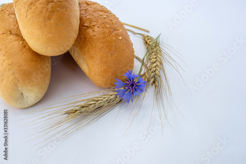 sesame bread rolls and wheat ears