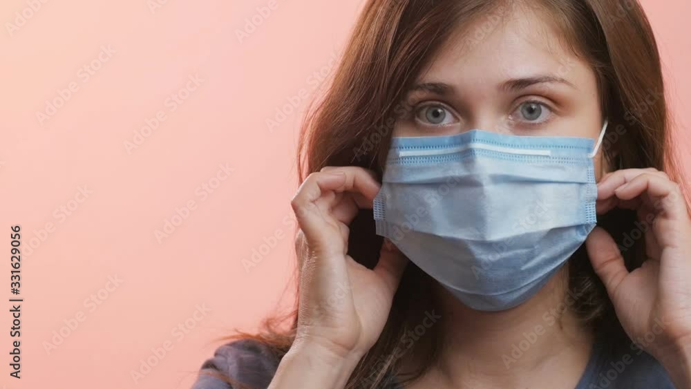 profile of girl removing protective medical mask from the face, fight against the epidemic of coronavirus is over, behavior of the surviving people profile of girl removing protective medical mask from the face, fight against the epidemic of coronavirus is over, behavior of the surviving people