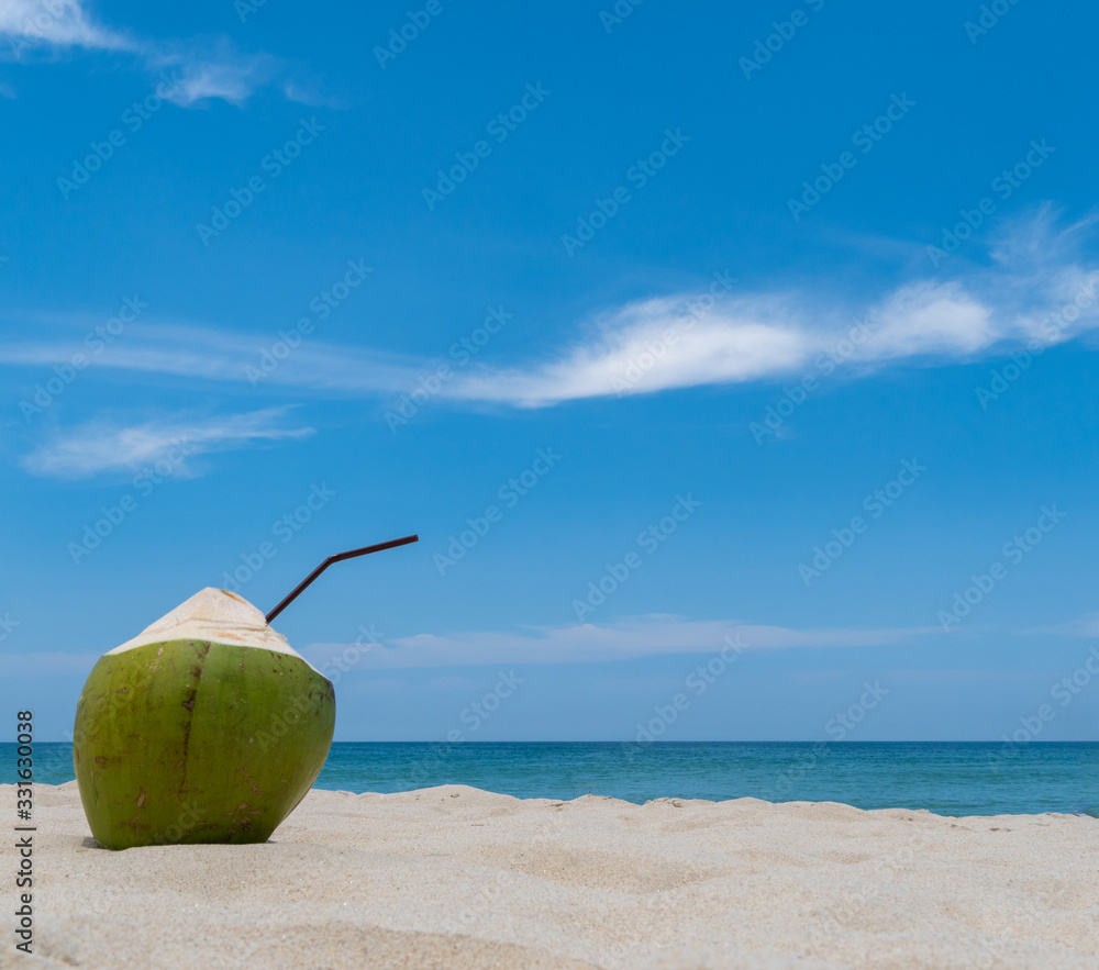 Refreshing coconut on a beautiful sandy beach Refreshing coconut on a beautiful sandy beach