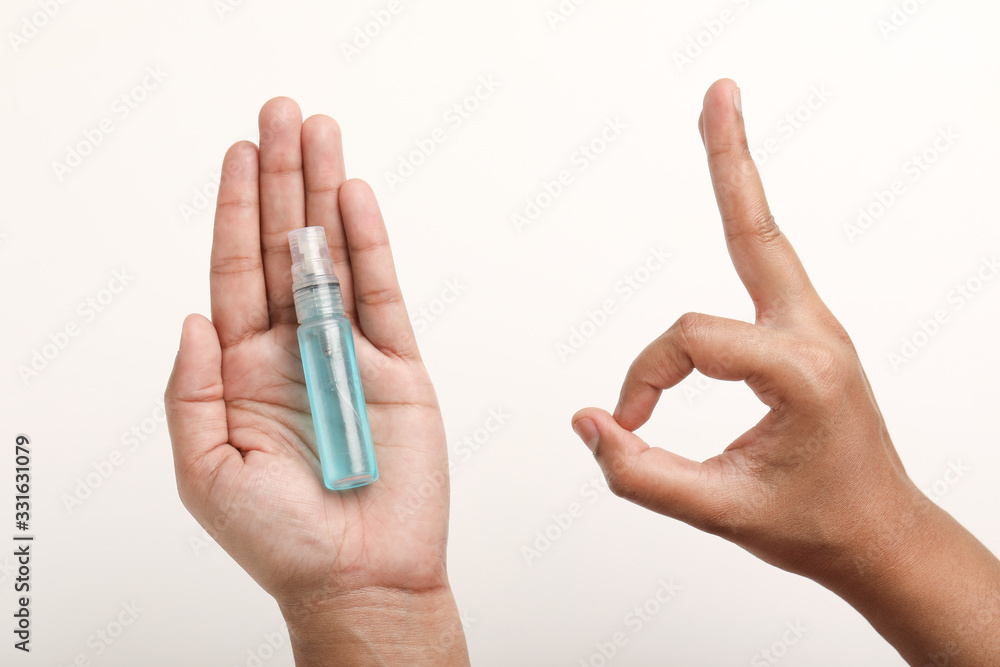 Hand holding in liquid sanitizer for best to avoid corona virus