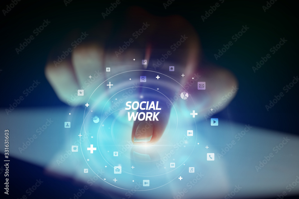 Finger touching tablet with social media icons and SOCIAL WORK