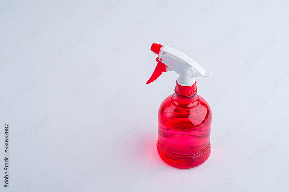 Red water foggy spray on white background. Red spray bottle. Red water foggy spray on white background. Red spray bottle.