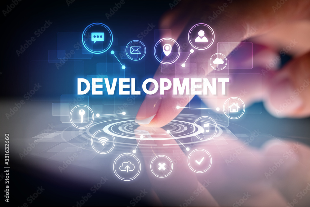 Fototapeta premium Finger touching tablet with web technology icons and DEVELOPMENT inscription, web technology concept