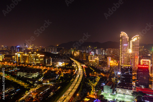 an aerial nightscape of downtown shenzhen, china, stacked from two raw files