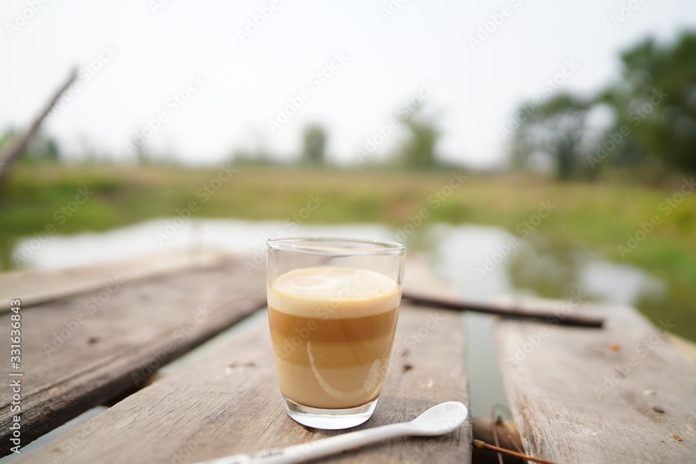 cup of coffee on wooden table cup of coffee on wooden table