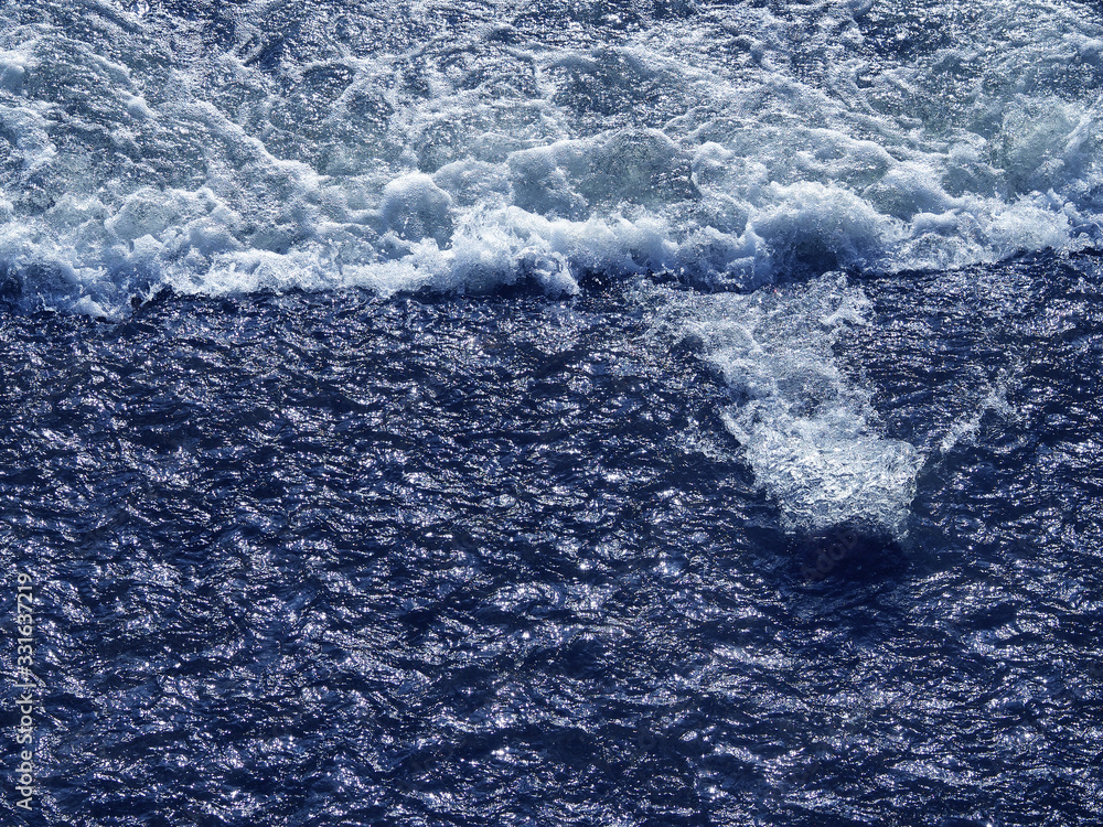 Fototapeta premium A bubbling stream of water. River flow. Background and texture.