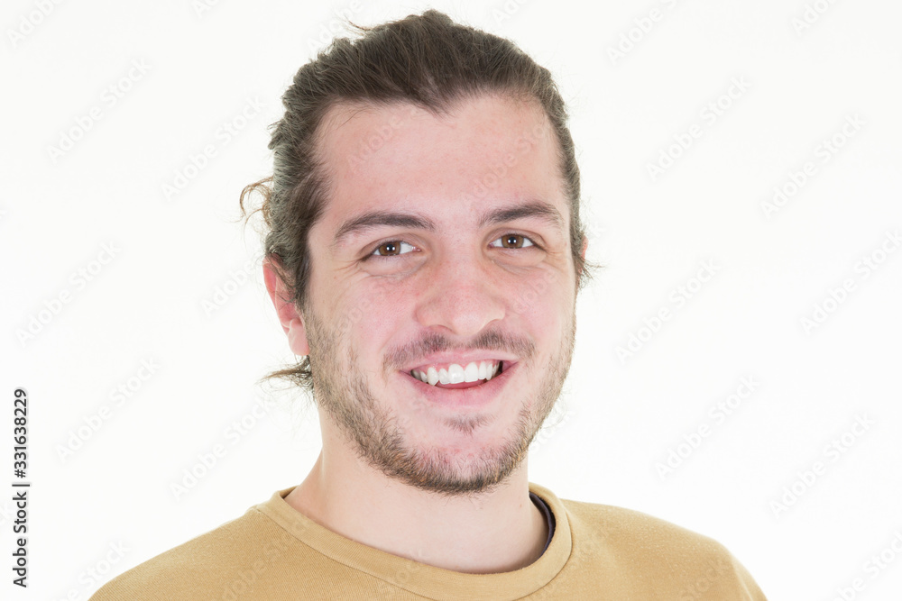 Portrait of smiling bearded man looking at the camera on white background Portrait of smiling bearded man looking at the camera on white background