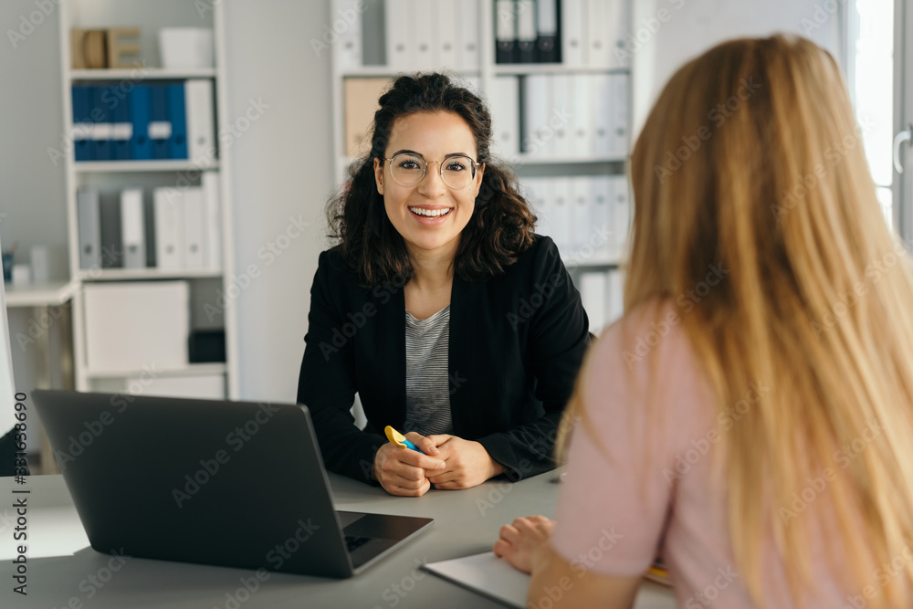 © contrastwerkstatt - Happy vivacious smart young businesswoman