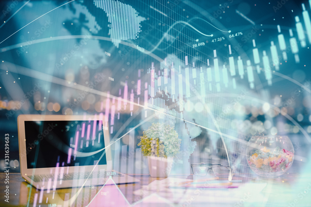 Forex graph hologram on table with computer background. Double exposure. Concept of financial markets. Forex graph hologram on table with computer background. Double exposure. Concept of financial markets.