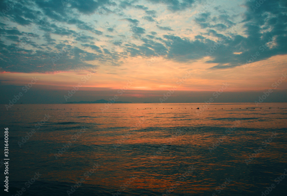 Breathtaking seascape in Thailland in summer. Blue and pink sunset. Sandy beach is full of wildness and freshness. Suitable for poster template, leaflet, greeting card. Back lit. Touristic concepts. Breathtaking seascape in Thailland in summer. Blue and pink sunset. Sandy beach is full of wildness and freshness. Suitable for poster template, leaflet, greeting card. Back lit. Touristic concepts.