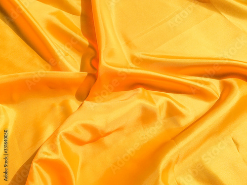 Minimal yellow fabric texture background. smooth elegant wavy light with cpoy space photo