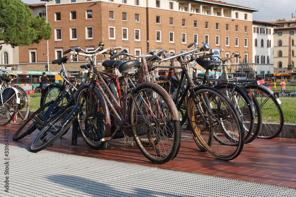 Traditional italian street and bikes parking. Lifestyles concepts.