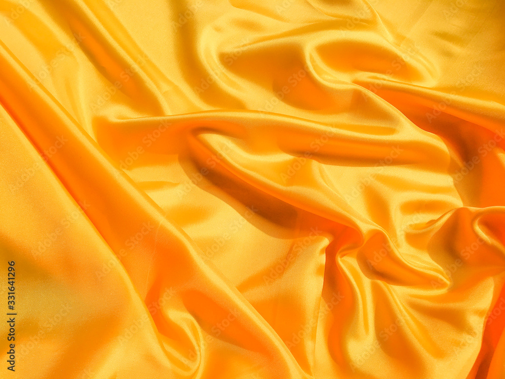 Yellow silk or satin texture background with copy space for design Yellow silk or satin texture background with copy space for design