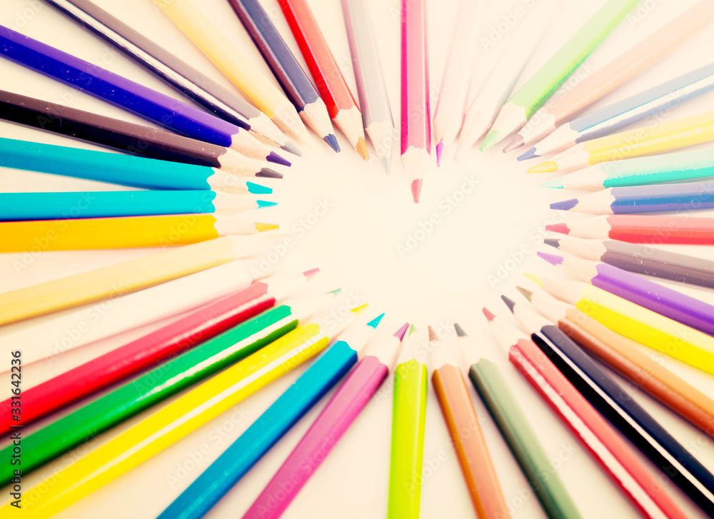 colored pencils lying around the heart colored pencils lying around the heart