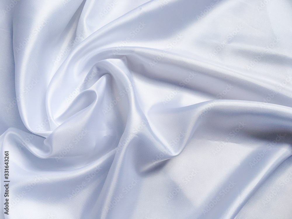 Obraz premium white crumpled fabric texture background. Silk curtain with fold waves for design
