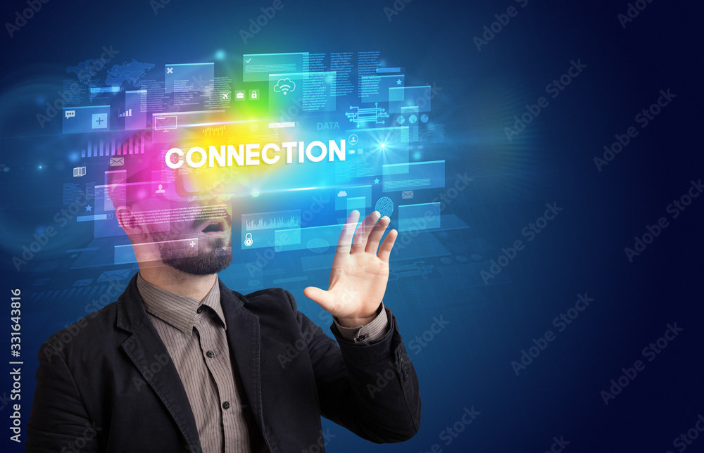 Businessman looking through Virtual Reality glasses with CONNECTION inscription, innovative security concept Businessman looking through Virtual Reality glasses with CONNECTION inscription, innovative security concept