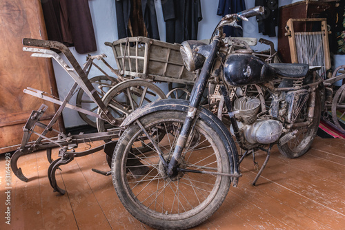 Old wagon and motorcycle in a cottage in Stircea, small village in Glodeni District of Moldova © Fotokon
