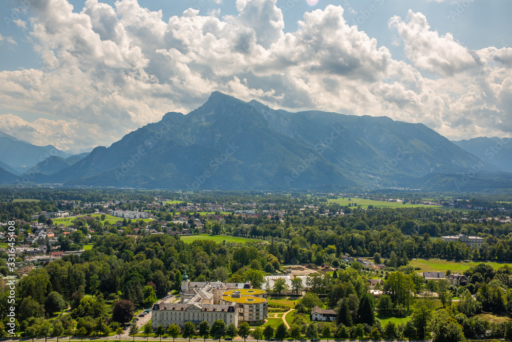 Aerial panorama of Salzburg and Alp mountains with magnificent clouds
