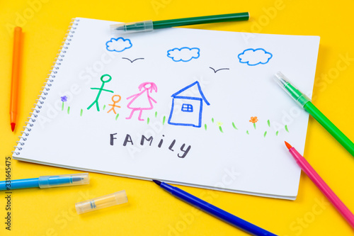 Home, love, family, still life concept. felt-tip pen lying on a paper with children's drawing family. Selective focus, copy space background