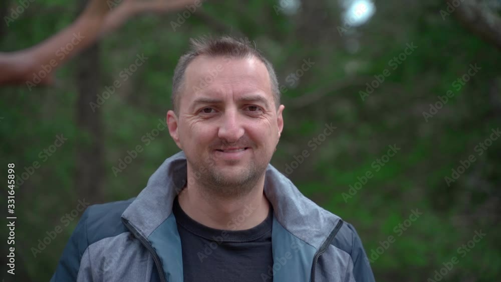 Closeup portrait of a man with a cleft lip looking at the camera smiling and turning his head in different directions Closeup portrait of a man with a cleft lip looking at the camera smiling and turning his head in different directions