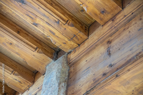 Architectonic detail, wooden log room corner, decor motif