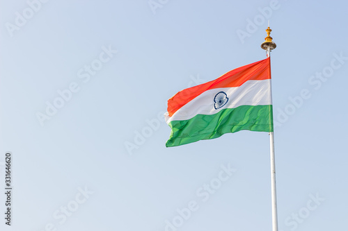 Indian flag flying high on a flagpost