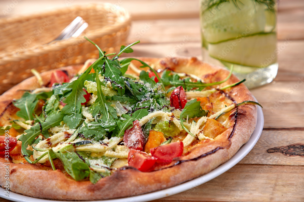 pizza with fresh vegetables on the wooden background pizza with fresh vegetables on the wooden background