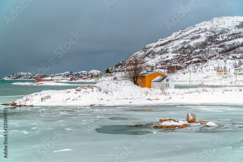 Frozen waters in Sommaroya Island in Northern Norway photo