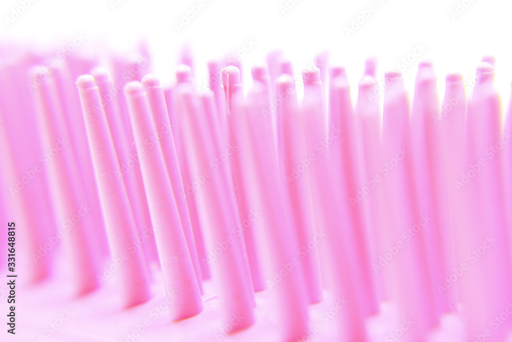 macro photo of pink hair comb macro photo of pink hair comb