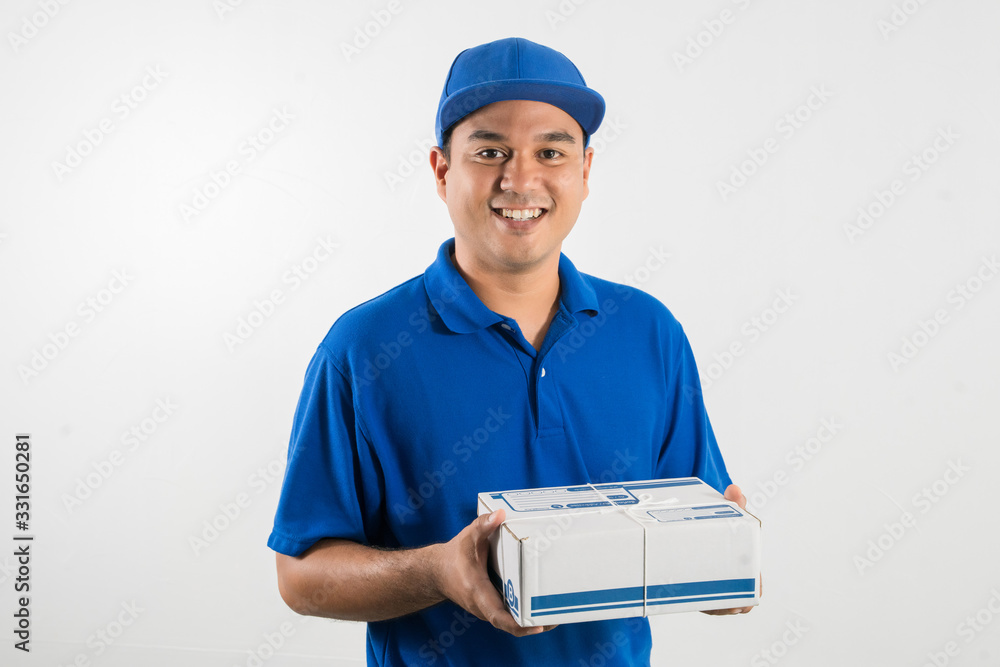 Blue Delivery handsome asian man holding parcel cardboard box on isolated white background. Blue Delivery handsome asian man holding parcel cardboard box on isolated white background.