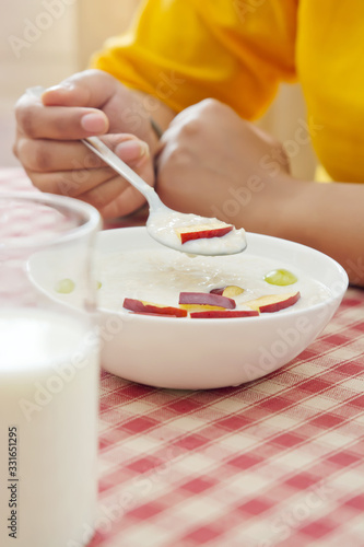 Woman Eating Breakfast
