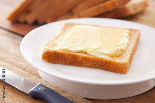 Bread and butter with knife

